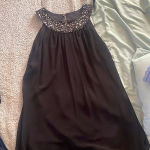 Dress with beads at the neck